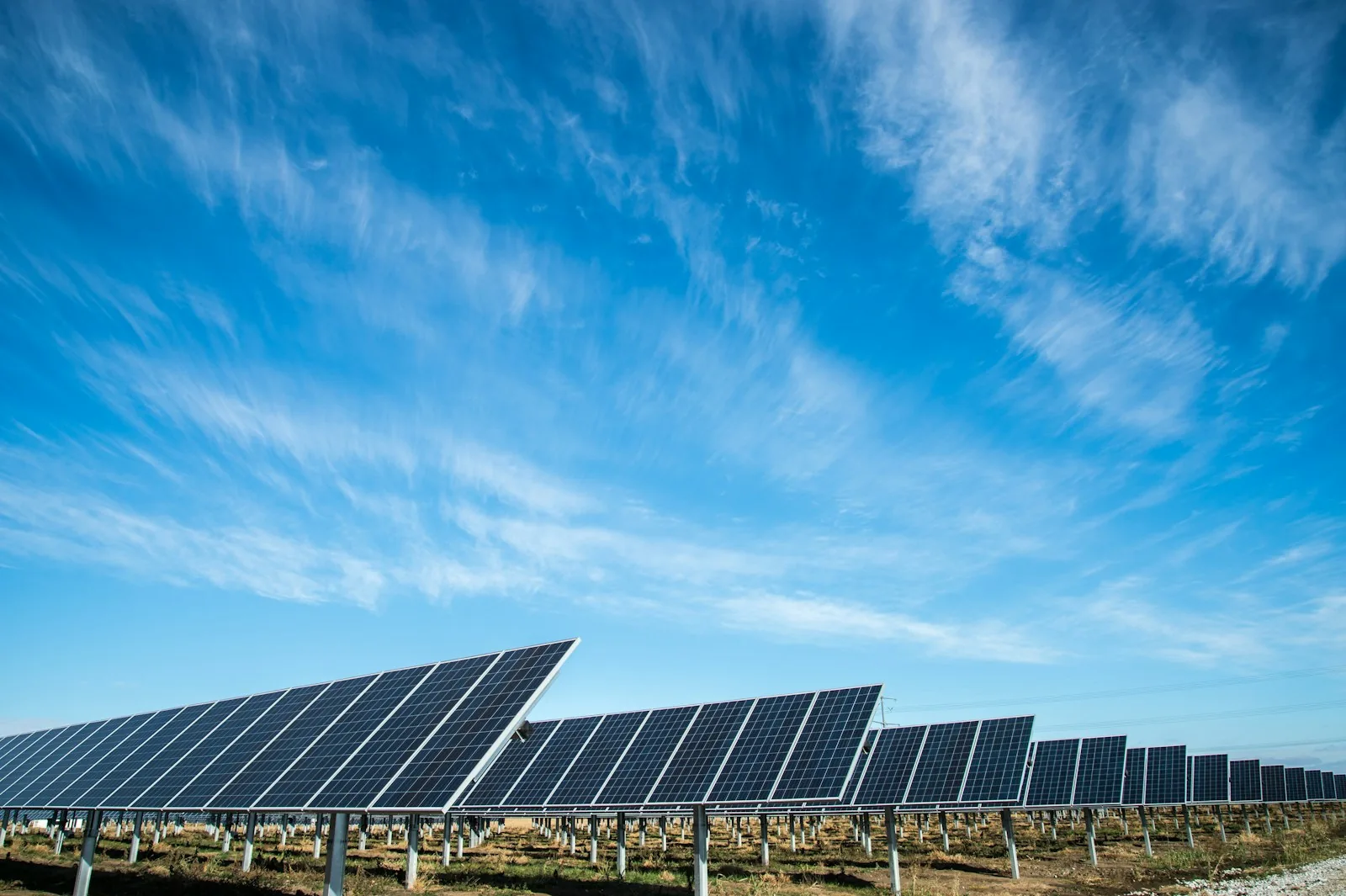 Photovoltaic panels under a blue sky. Photograph by American Public Power Association.